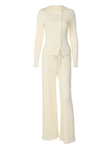 Women's cream white knitted ribbed lounge set featuring button-up top and wide-leg pants