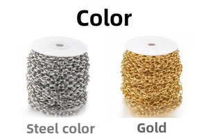 Close-up of 18k gold plated and steel wide curved chain on white spools for DIY jewelry
