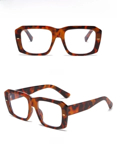 Detail of tortoise shell square glasses frame with anti blue light protective lenses