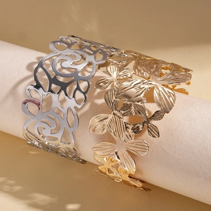 Minimalist open bangle with hollow floral patterns in gold and silver finish