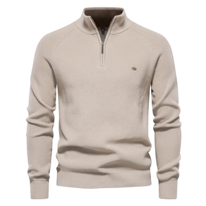 Detail of men's beige half-zip sweater showing high-quality knit texture and stand collar
