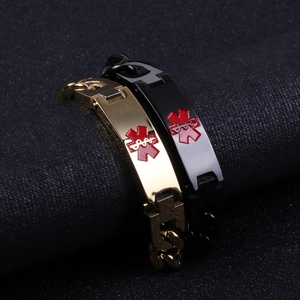 Close-up of gold and black medical alert bracelets with red Star of Life symbol