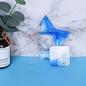 Macro shot of blue gradient star-shaped resin photo frame with elegant gold foil details