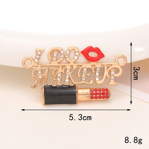 Detail view of the I Love Makeup metal brooch with rhinestones and dimensions shown
