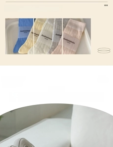 Detail of soft combed cotton crew socks with sweet bow patterns in pastel macaron colors