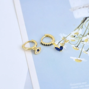 S925 silver needle evil eye earrings set with blue zircon studs in gold plating