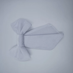 Close-up of white velvet butterfly bow decoration for wedding and party wall backdrop