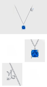 Detail of 925 sterling silver Capricorn necklace with blue zircon and hand-set charms