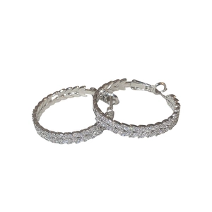 Silver hoop earrings with zircon leaf design for a modern minimalist fashion look