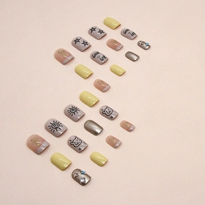 Short yellow and grey press-on nails with glitter, cute bear patterns and tiny rhinestones