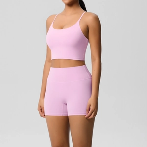 Detail of high-waisted seamless lavender yoga shorts and racerback sports bra set
