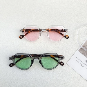 Detailed top view of retro round sunglasses with CE markings on tortoiseshell temples