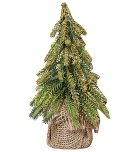Detailed view of mini green Christmas tree with gold glitter and burlap base