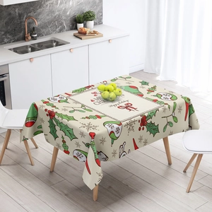 Rectangle beige Christmas tablecloth with Merry Christmas prints on a wooden dining table