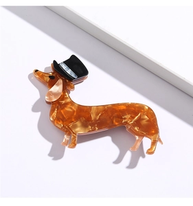 Detailed macro shot of dachshund-shaped hair clip with top hat and tortoiseshell texture