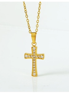 Macro view of gold cross pendant with micro-pave cubic zirconia crystals (Chain not included)