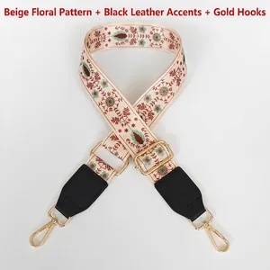 Close-up of beige floral embroidery on ethnic style wide strap with gold metal hooks