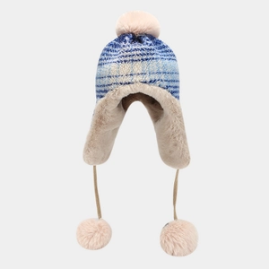 Detail of blue and white striped knit earflap hat with soft plush lining and pom-poms