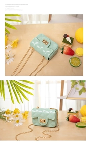 Detailed view of mint green jelly mini bag with gold chain and quilted PVC texture