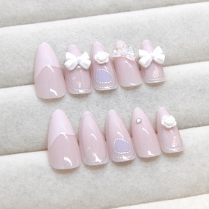 Pink and white press-on nails set with 3D bows, roses and pearl accents in a gift box