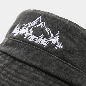 Outdoor hiking sun hat in charcoal grey with detailed white mountain pine embroidery