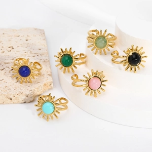 Detail of adjustable gold stainless steel rings with colorful turquoise and malachite stones