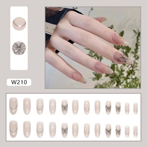 Silver glitter butterfly press-on nails in nude pink, medium length almond shape