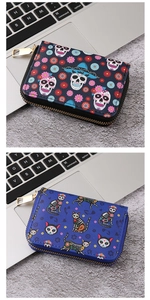 Detail of gothic Halloween PU leather wallets featuring sugar skull and skeleton cat patterns