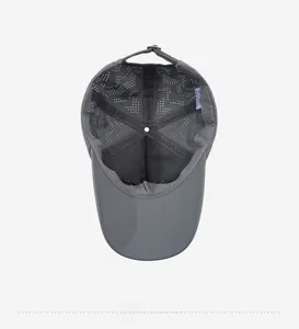 Detail of gray baseball cap interior featuring breathable laser-cut holes and mesh lining