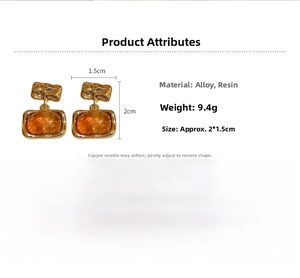 Detail view of retro square resin earrings with gold plating and silver needles