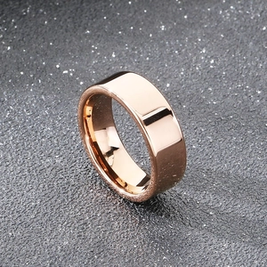 Detailed close-up of 8mm rose gold tungsten steel ring with a polished mirror finish