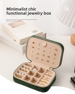 Deep green velvet jewelry organizer interior with ring slots and earring holder board