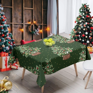 Green Christmas tablecloth with tree and wreath patterns on a festive wooden table
