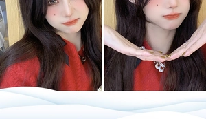 Detail of silver letter B pendant necklace and matching minimalist ring on red sweater