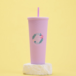 Detail of light purple studded tumbler featuring Best Mom Ever text on white stone base