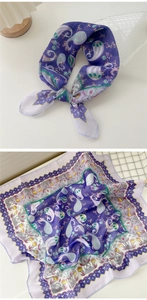 Detail of purple paisley cotton linen scarf showing delicate fabric texture and pattern