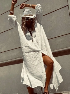 White eyelet embroidery maxi dress with long sleeves and ruffled hem for summer beach