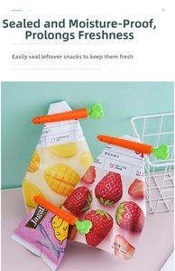 Close-up of orange carrot-shaped bag sealing clips for food preservation and kitchen use