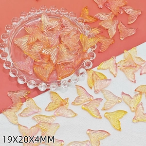 Macro shot of 19x20x4mm gradient fishtail charms for DIY jewelry making