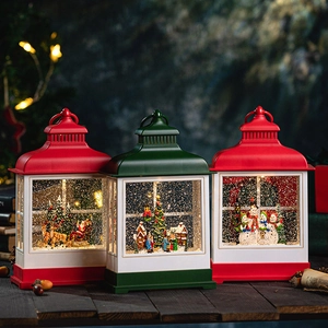 Vintage Christmas lantern set with Santa, tree, and snowman scenes on table