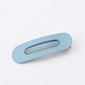 Matte light blue oval hair clip with minimalist design and textured frosted finish