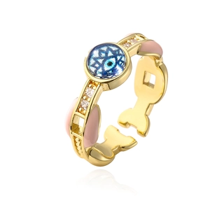 Macro side view of 18K gold plated ring with pink enamel and blue evil eye zircon
