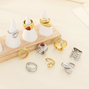 10-piece gold and silver ring set featuring teardrop crystals and knot designs