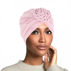 Detailed view of the pink turban cap featuring an elegant braided flower knot design