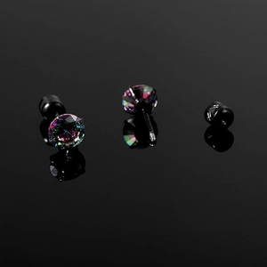Macro shot of colorful cubic zirconia stud with black stainless steel screw back detail