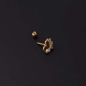 Golden hollow heart earring with marquise zirconia and screw back on black background