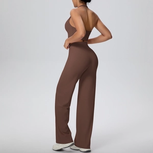 Detail view of the open-back halter sports vest and high-waisted wide-leg yoga pants