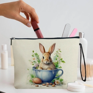Easter makeup bag with realistic bunny in teacup print and black zipper strap