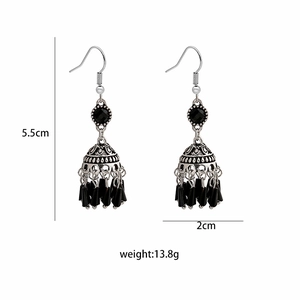 Detailed view of silver dreamcatcher earrings with black beads showing 5.5cm length measurement