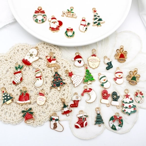 Mix of colorful Christmas enamel charms featuring Santa, tree, and wreath designs